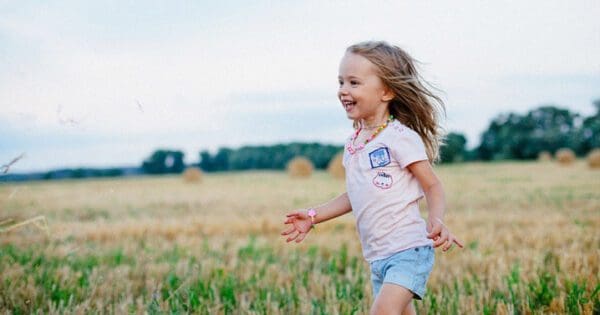 child playing in field