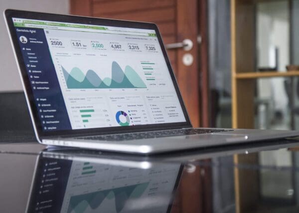A computer on a desk. the screen is depicting The Hottest Trends in Interoception Research