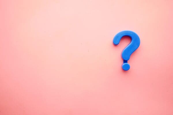 a pink background with a blue question mark over it to indicate Frequently Asked Questions About Interoception